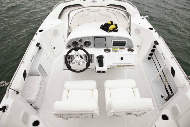 Helm Wakeboarders want a giant wake to launch from as they cross from left to right behind the boat. With the engine set back against the transom, these boats carve a steep, large wake that riders love.